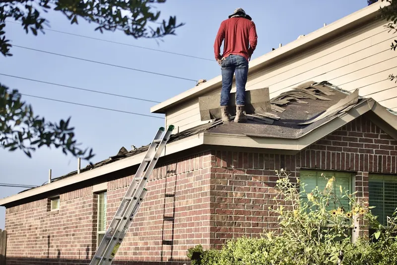 Professional roofer working on a residential roof in Downtown Marysville